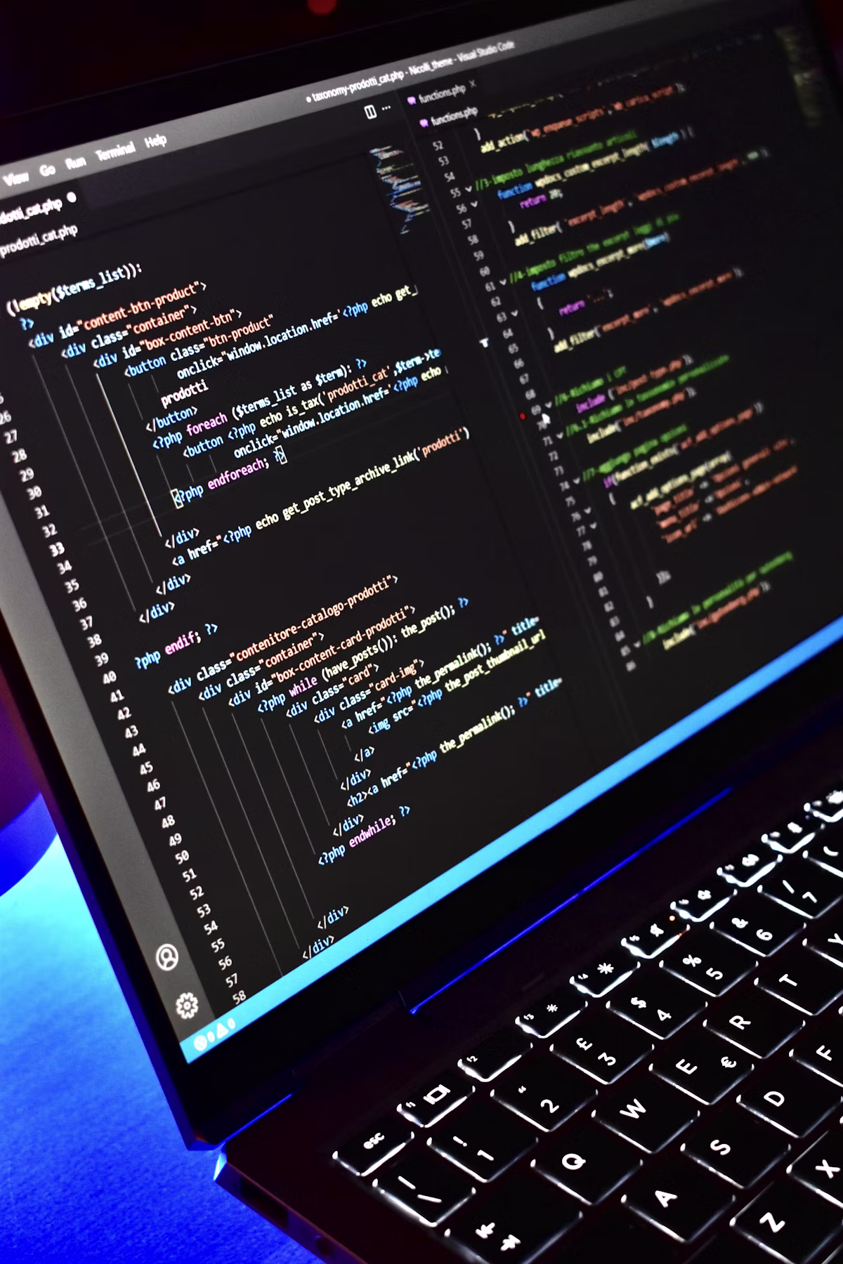 Developer writing website code on screen